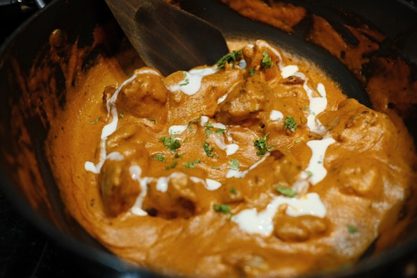 Chicken tikka masala in creamy tomato sauce with rice