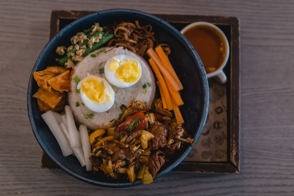Korean bibimbap bowl with rice, vegetables, egg, and gochujang