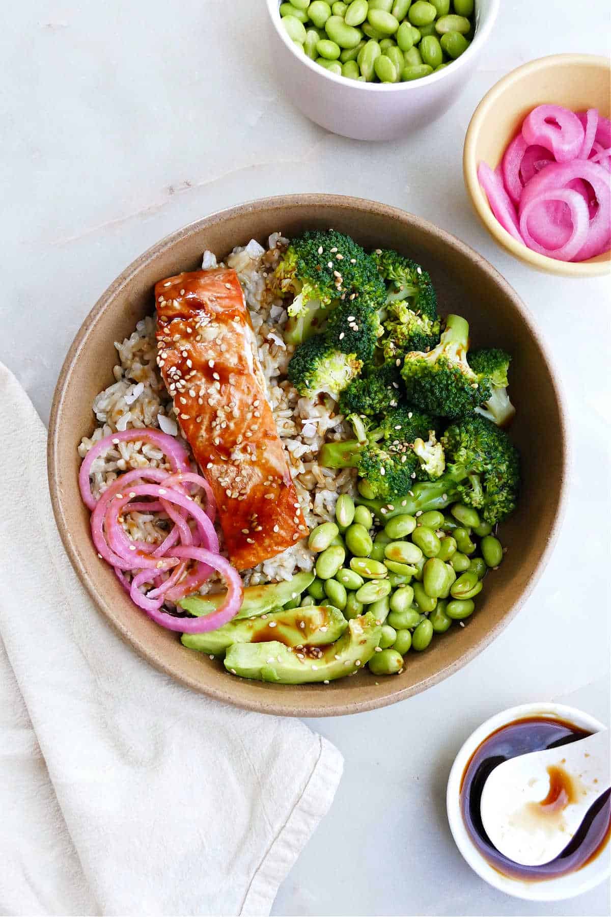 Glazed teriyaki salmon over rice with steamed vegetables